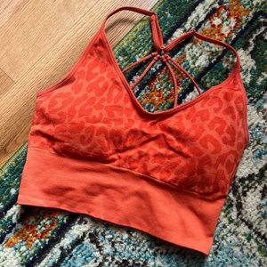 Orange leopard print sports bra